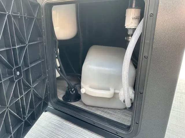 Slide: The Image of Interior view of Viaggio Lago X-F 2025 storage compartment with water tank and hoses. - 10