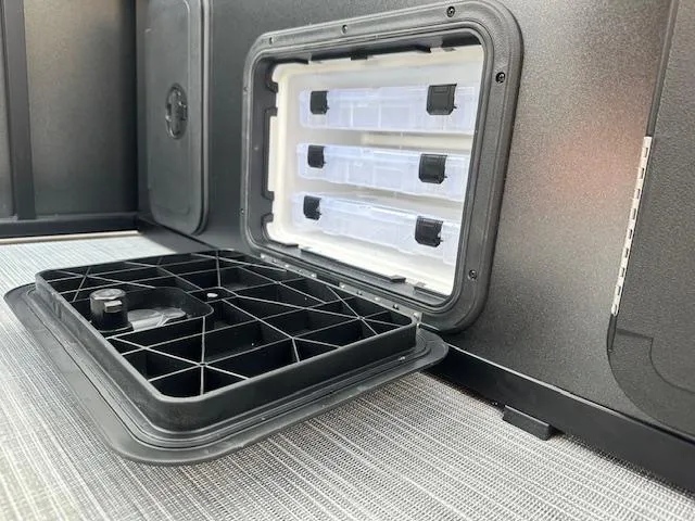 Slide: The Image of Interior compartment of 2025 Viaggio Lago X-F, showcasing storage features and design. - 11