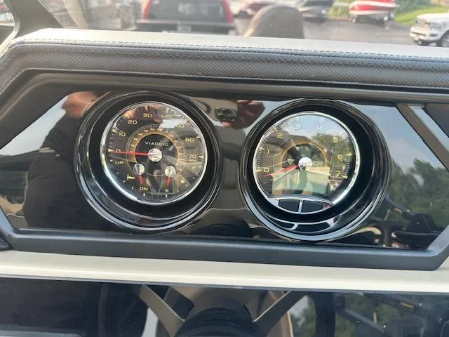 Slide: The Image of Dashboard of 2025 Viaggio Lago X-F with dual gauges, showcasing speed and RPM. - 16