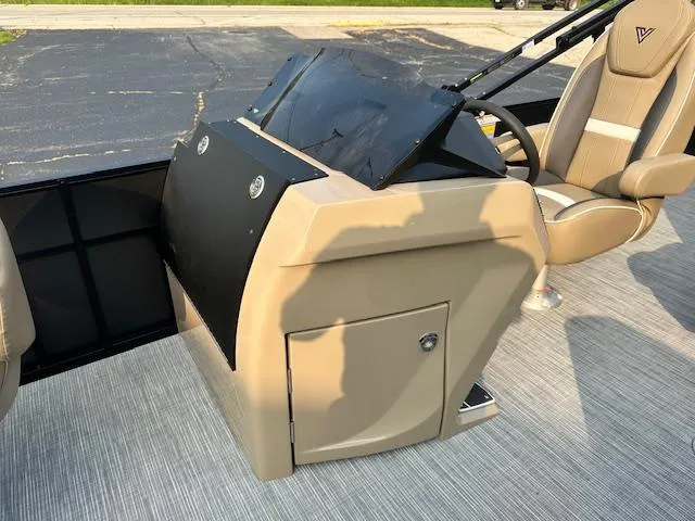 Slide: The Image of 2025 Viaggio Lago X-F boat console with beige seating and sleek design. - 18