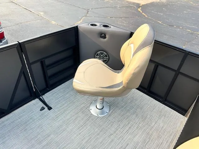 Slide: The Image of 2025 Viaggio Lago X-F boat interior with beige swivel seat and cup holders. - 20