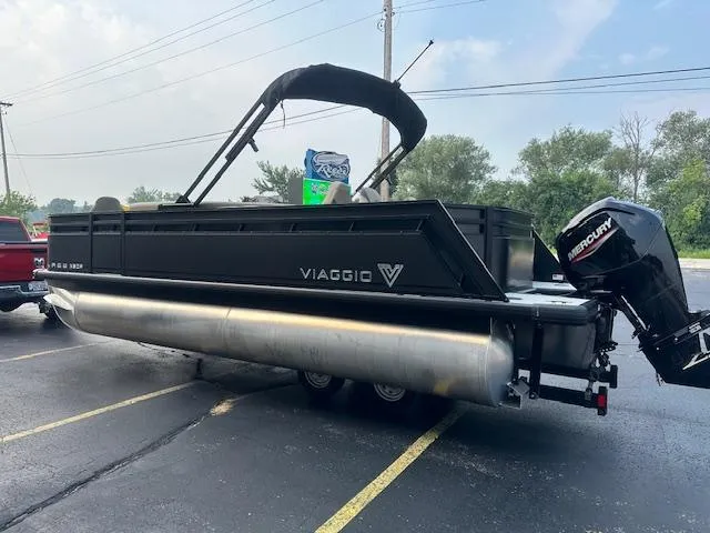 Slide: The Image of 2025 Viaggio Lago X-F pontoon boat with Mercury outboard motor on a trailer. - 4