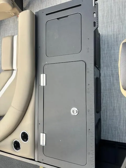 Slide: The Image of Interior of 2025 Viaggio Lago X-F with storage compartment and cup holders. - 7