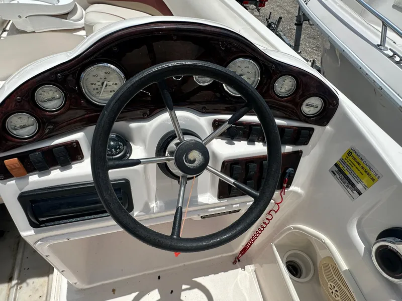 Slide: The Image of 2004 Hurricane FunDeck GS 202 OB boat dashboard with steering wheel and gauges. - 10