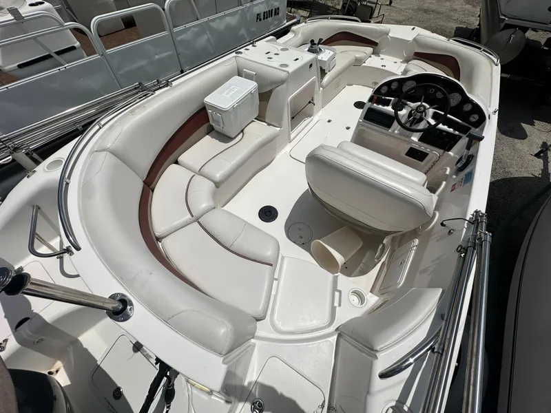Slide: The Image of 2004 Hurricane FunDeck GS 202 OB boat interior with seating and steering console. - 3