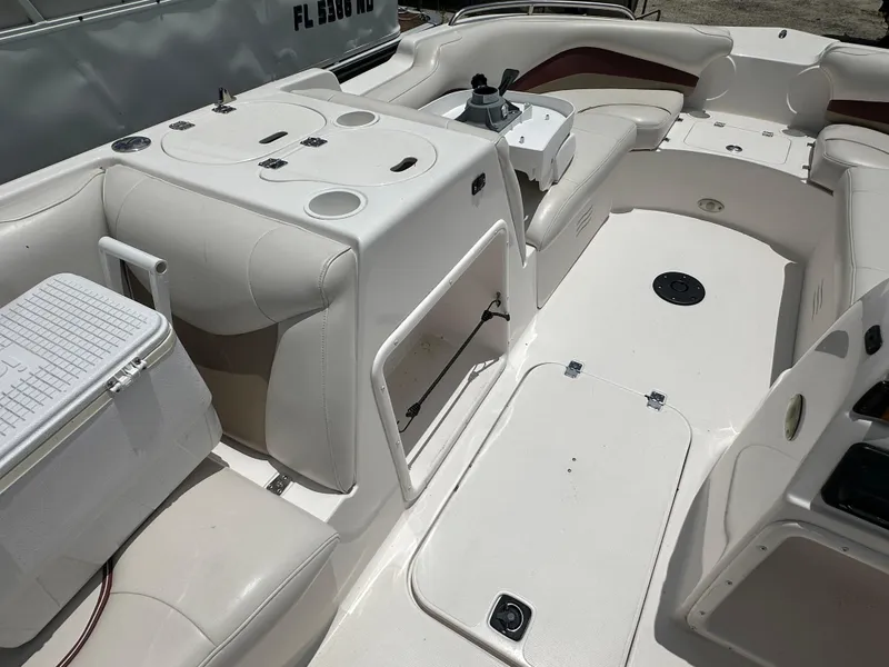 Slide: The Image of 2004 Hurricane FunDeck GS 202 OB interior with seating and storage compartments. - 6