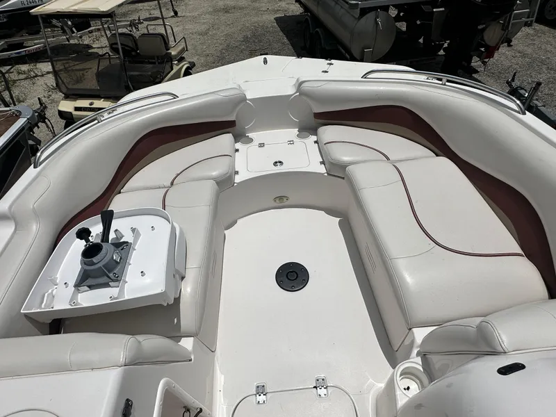 Slide: The Image of 2004 Hurricane FunDeck GS 202 OB boat interior with white seating and red accents. - 7