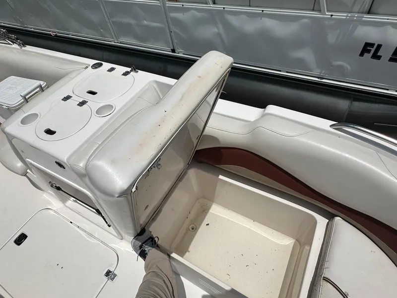 Slide: The Image of 2004 Hurricane FunDeck GS 202 OB boat interior with open storage compartment. - 8