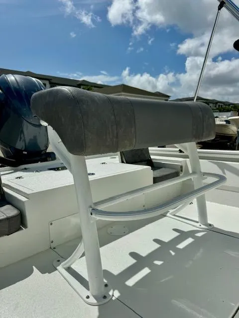 Slide: The Image of Avid 21 Mag 2025 boat seat with cushioned backrest under a sunny sky. - 10