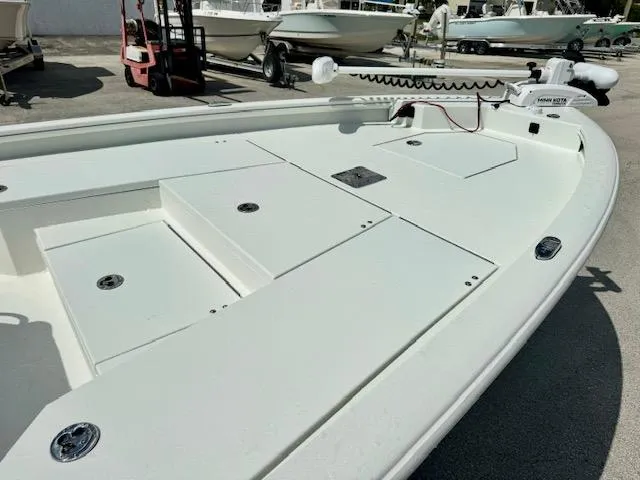 Slide: The Image of Avid 21 Mag 2025 boat deck with storage compartments and trolling motor. - 8