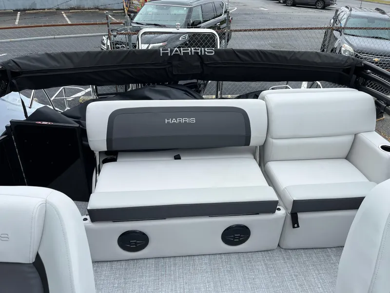 Slide: The Image of 2026 Harris Cruiser 230 boat interior with white and gray seating. - 10