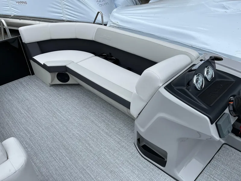 Slide: The Image of 2026 Harris Cruiser 230 boat interior with sleek seating and modern dashboard. - 12