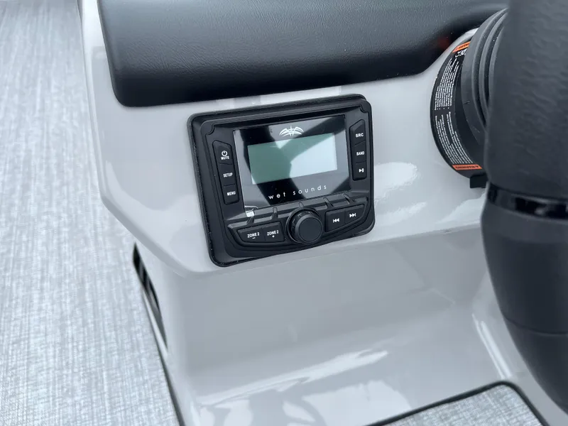 Slide: The Image of 2026 Harris Cruiser 230 dashboard with Wet Sounds audio system. - 15