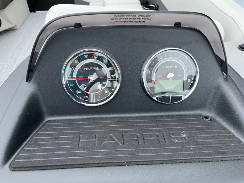 Slide: The Image of Dashboard of 2026 Harris Cruiser 230 with speedometer and tachometer. - 16
