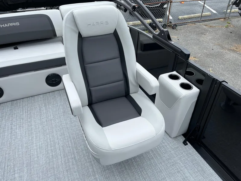 Slide: The Image of 2026 Harris Cruiser 230 boat seat with cup holders, featuring sleek gray and white design. - 9