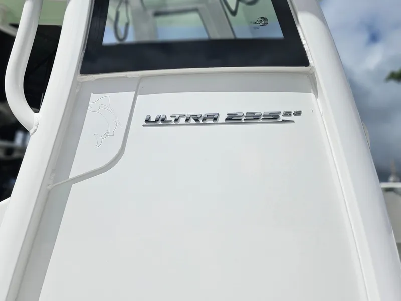 Slide: The Image of 2025 Sea Hunt Ultra 235 SE boat emblem on white surface. - 8