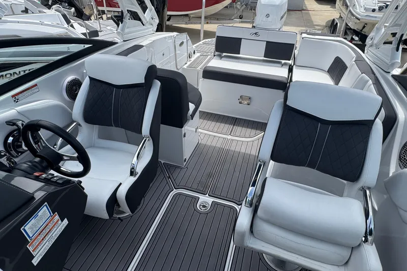 Slide: The Image of 2023 Monterey M-65 boat interior with sleek seating and modern dashboard design. - 3