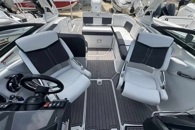 Slide: The Image of 2023 Monterey M-65 boat interior with modern seating and sleek design. - 5