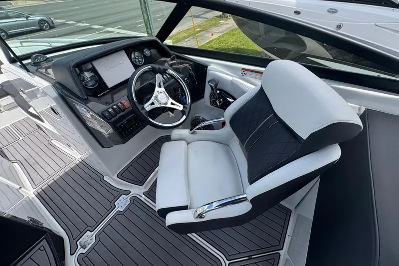 Slide: The Image of 2023 Monterey M-65 boat cockpit with modern steering and control panel. - 6