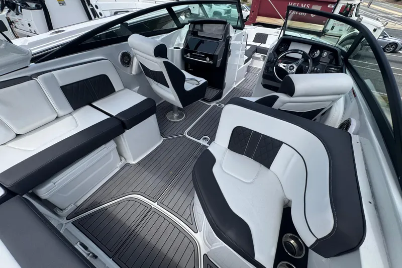 Slide: The Image of Luxurious interior of 2023 Monterey M-65 boat with sleek seating and modern dashboard. - 9