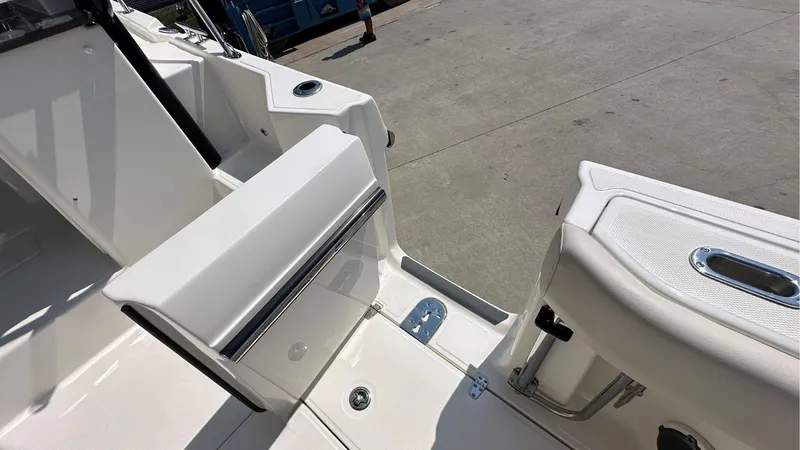 Slide: The Image of 2026 Boston Whaler 325 Conquest boat interior, featuring sleek white seating and modern design elements. - 12