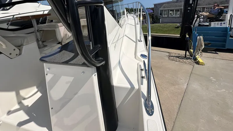 Slide: The Image of 2026 Boston Whaler 325 Conquest boat deck with sleek design and modern features. - 15