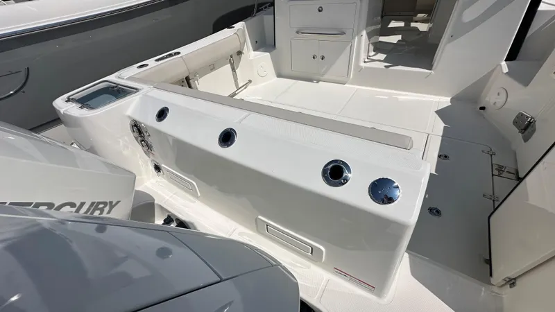 Slide: The Image of 2026 Boston Whaler 325 Conquest boat interior with seating and storage compartments. - 3