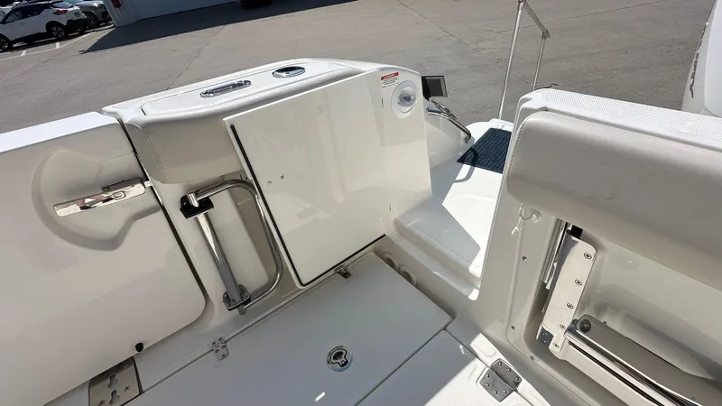 Slide: The Image of 2026 Boston Whaler 325 Conquest boat deck with seating and storage compartments. - 4
