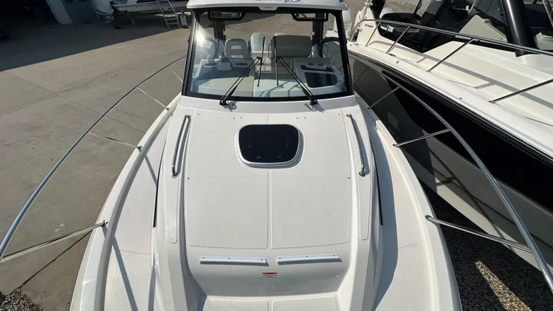 Slide: The Image of 2026 Boston Whaler 325 Conquest boat, top view, docked in marina. - 54