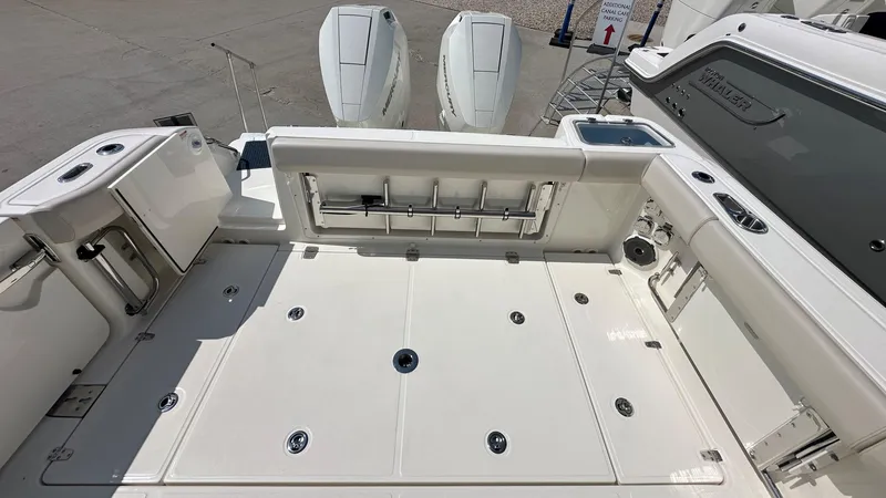 Slide: The Image of 2026 Boston Whaler 325 Conquest boat deck with storage and seating. - 6
