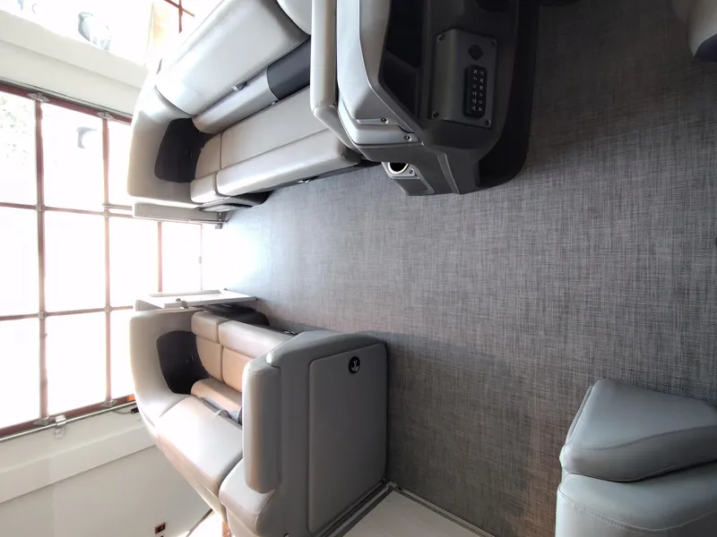 Slide: The Image of Interior of 2026 Sun Tracker Party Barge 20 with spacious seating and modern design. - 13