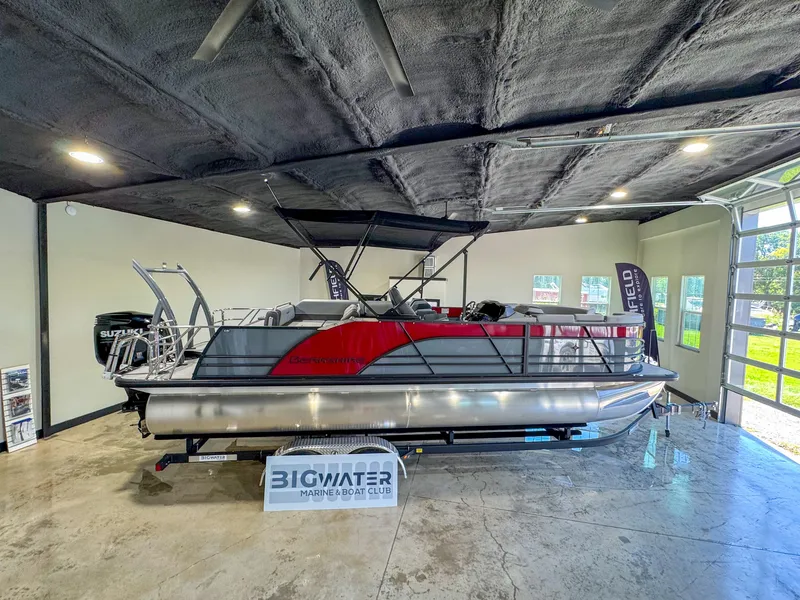 The Image of 2025 Berkshire 23SBE STS pontoon boat displayed indoors at Big Water Marine. - 1