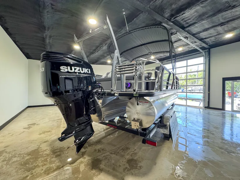 Slide: The Image of 2025 Berkshire 23SBE STS pontoon boat with Suzuki engine in showroom. - 14