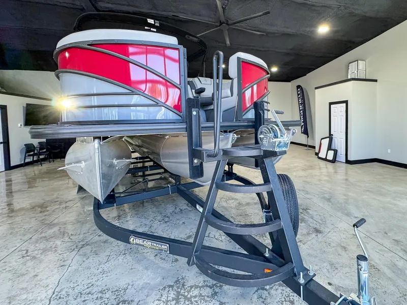 Slide: The Image of 2025 Berkshire 23SBE STS pontoon boat on trailer in showroom. - 6