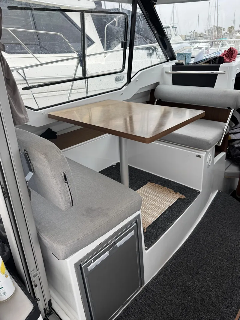 Slide: The Image of Interior of 2020 Jeanneau NC 795 boat with seating and table. - 14