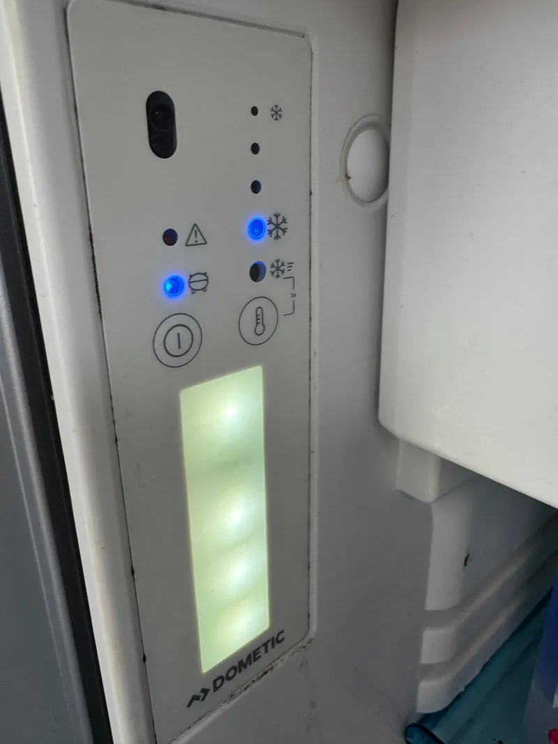 Slide: The Image of Control panel of a Dometic appliance on a 2020 Jeanneau NC 795 boat. - 31