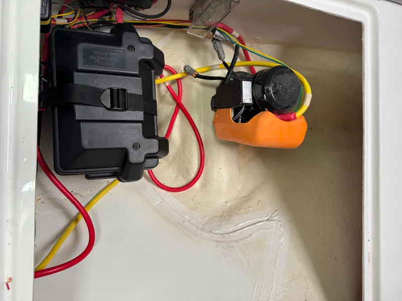 Slide: The Image of Battery compartment of 2020 Jeanneau NC 795 boat with wiring and components. - 46