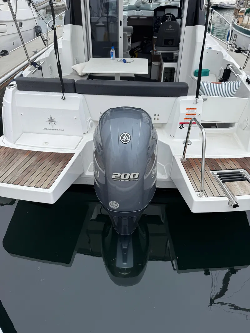 Slide: The Image of 2020 Jeanneau NC 795 boat with Yamaha 200 outboard motor, docked at marina. - 7