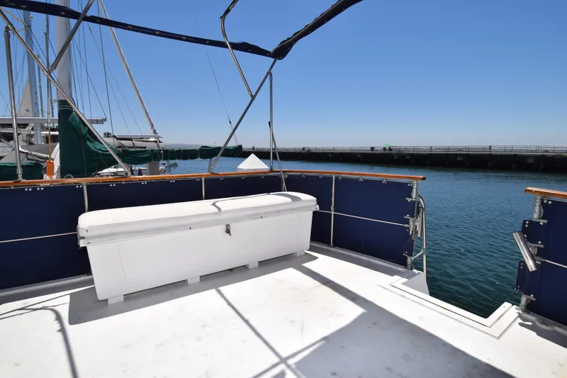 Slide: The Image of 1977 Uniflite 42 Double Cabin yacht deck with ocean view and storage box. - 21