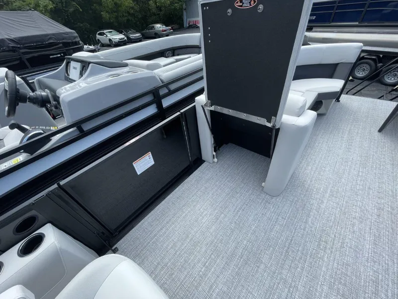 Slide: The Image of 2026 Harris Cruiser 230 interior with gray seating and flooring, showcasing modern design. - 10