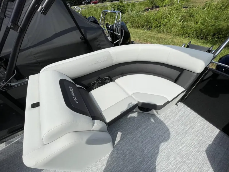 Slide: The Image of Luxurious seating on 2026 Harris Cruiser 230 boat with cup holders and sleek design. - 12
