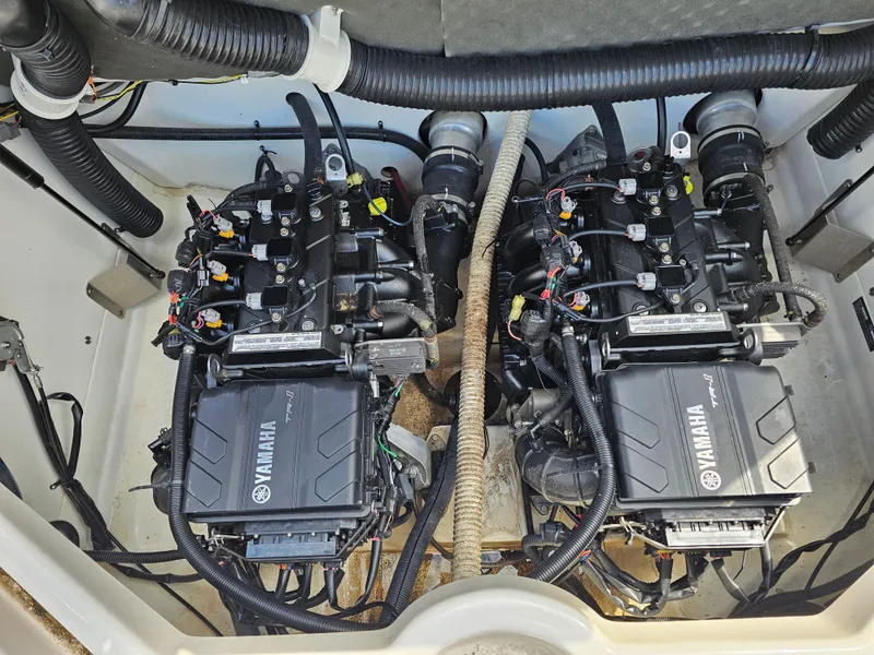 Slide: The Image of 2017 Yamaha SX210 boat engine compartment with dual engines and wiring. - 20