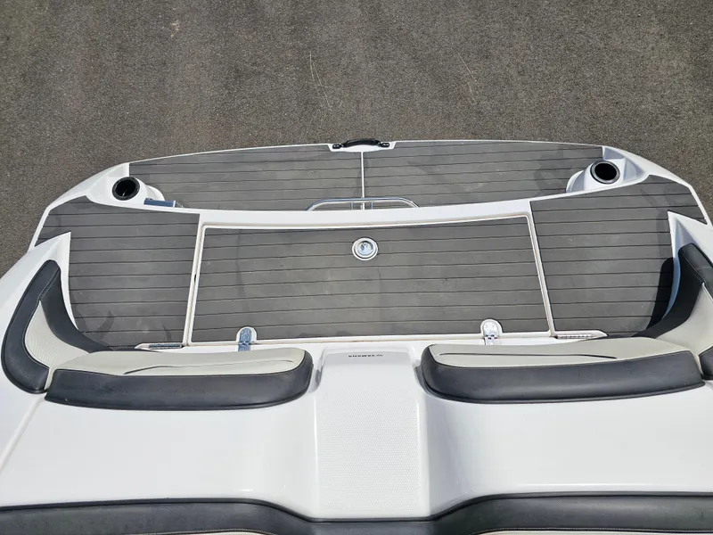 Slide: The Image of 2017 Yamaha Boats SX210 swim platform with cushioned seating and cup holders. - 21