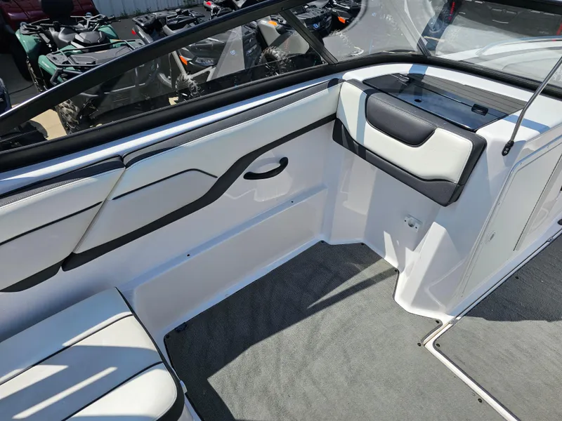 Slide: The Image of 2017 Yamaha Boats SX210 interior with seating and storage compartments. - 9