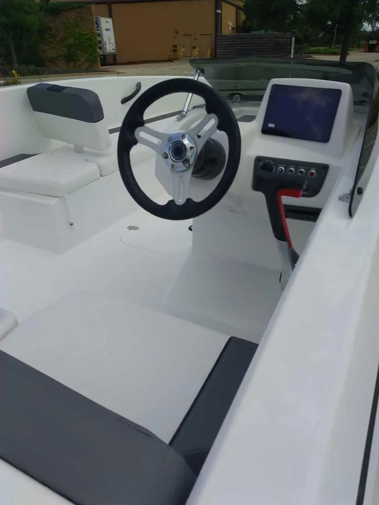 Slide: The Image of 2026 Tahoe T18 boat interior with steering wheel and control panel. - 3