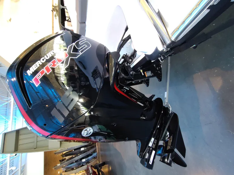 Slide: The Image of Mercury Pro XS outboard motor on 2026 Tahoe T18 boat, displayed indoors. - 6