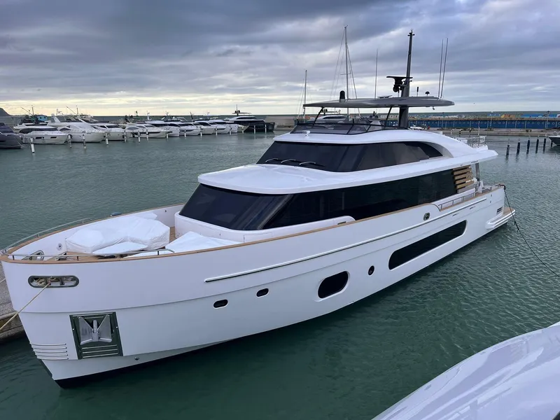 The Image of 2026 Azimut Magellano 25M yacht cruising near city skyline. - 0