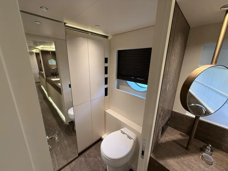Slide: The Image of Luxurious bathroom on 2026 Azimut Magellano 25M yacht with dual sinks and elegant lighting. - 25