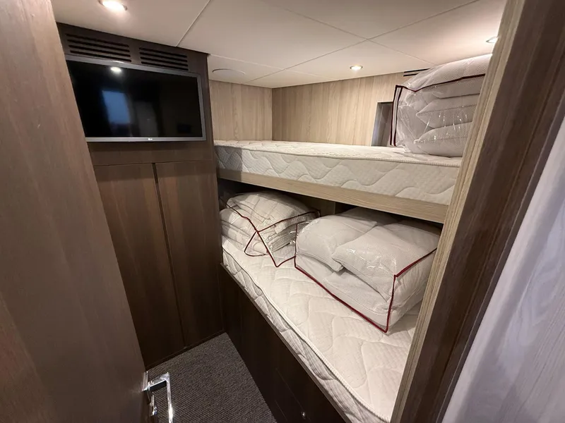 Slide: The Image of Interior of 2026 Azimut Magellano 25M yacht with twin bunk beds and modern design. - 47