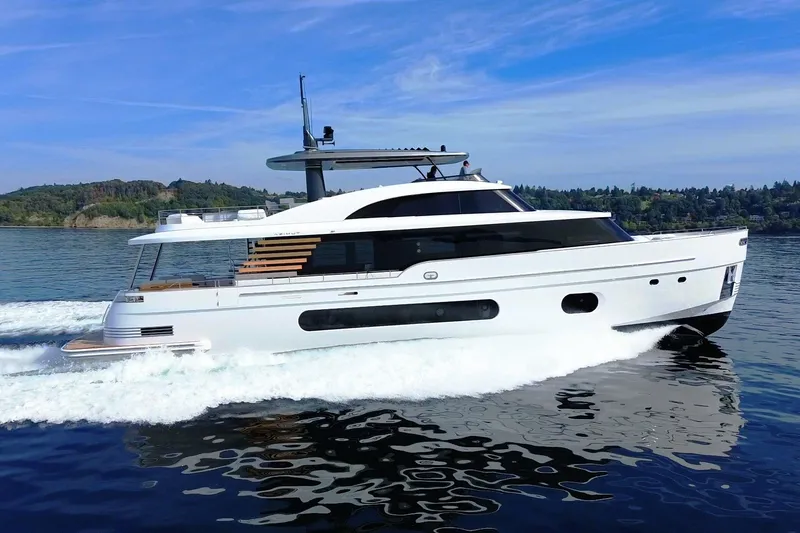 The Image of 2026 Azimut Magellano 25M yacht cruising on a serene lake with scenic backdrop. - 0